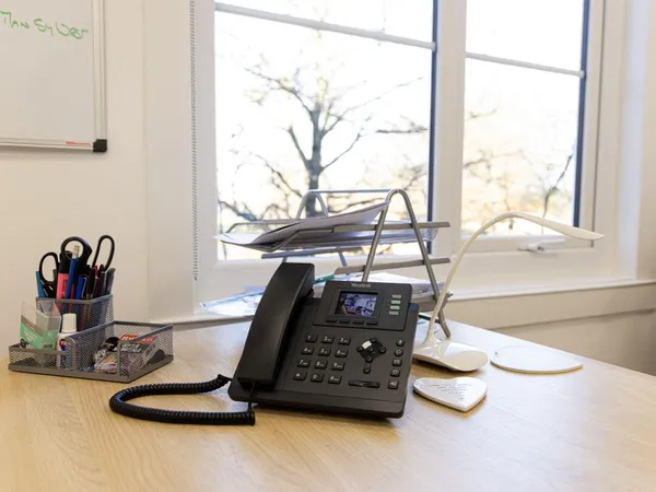 Phone system on hot desk reception at Index House, Ascot