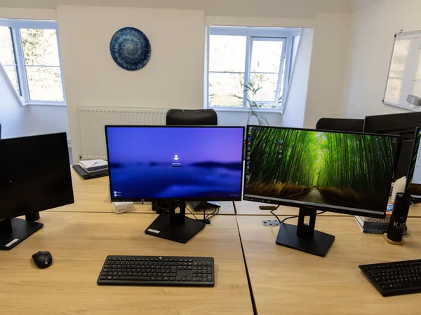 Double monitor setup on hot desk at Index House