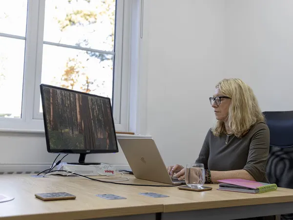 Woman working at hot desk in Ascot, Berkshire